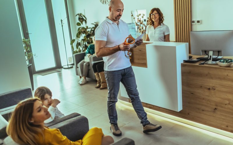 in the hospital's waiting room, patients are waiting for an examination while talking to the doctor